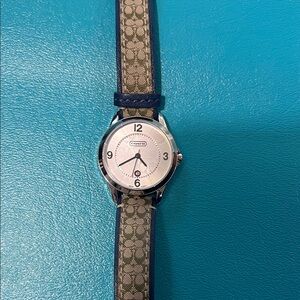 Coach logo brown and navy leather round face watch with Minute hand. Like new!!